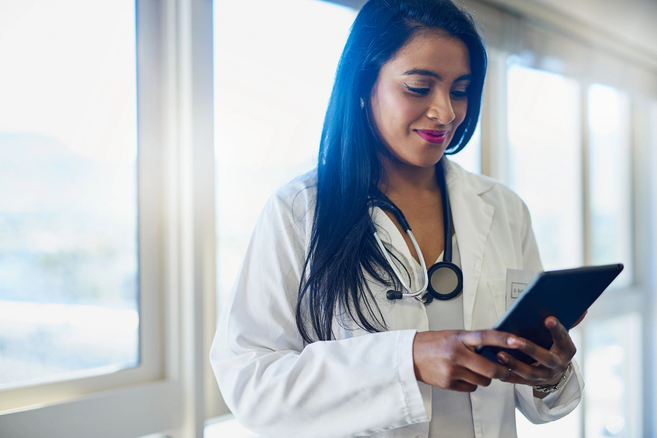 Doctor reviewing patient records on a tablet
